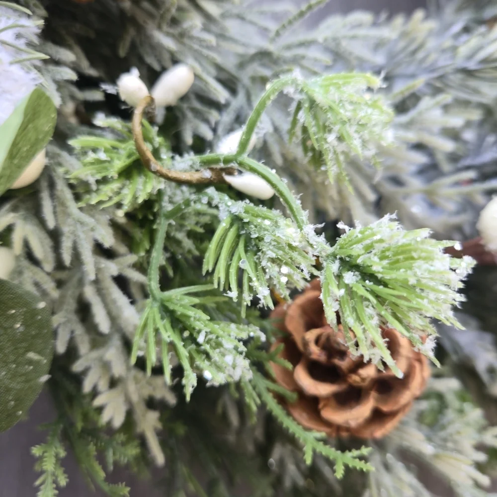 Handmade lush, artificial Winter Greenery Wreath With White And Brown Accents
